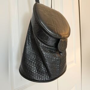 Black woven leather fishing bag style  bag. Cross body.